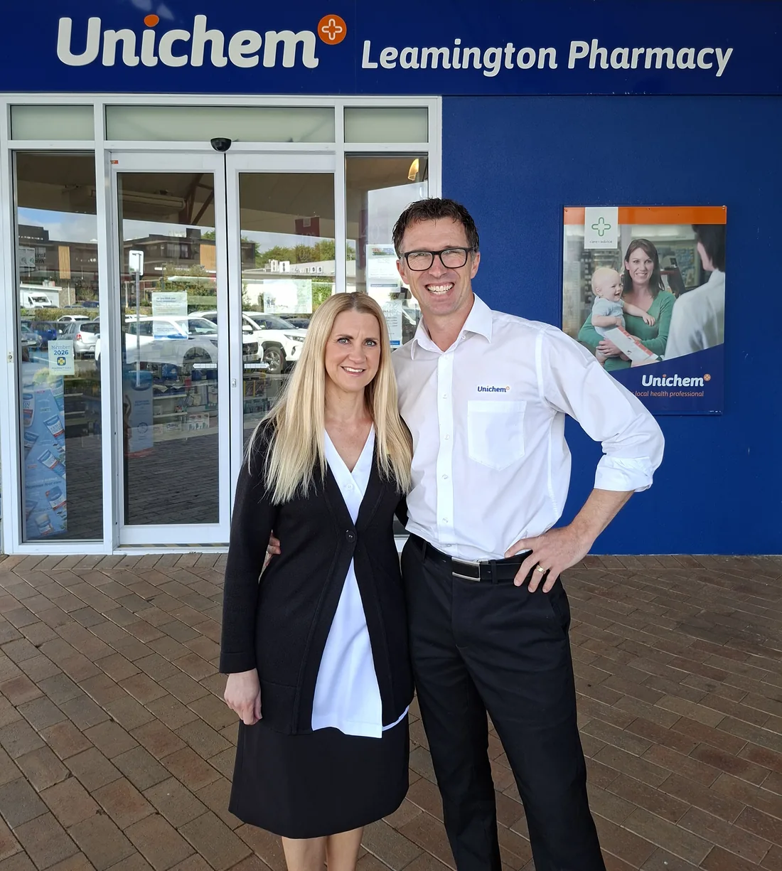 Nathan and Andrea outside Unichem Leamington Pharmacy
